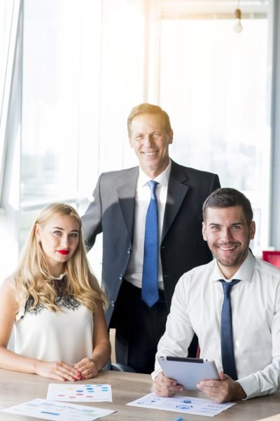 portrait-boss-with-his-two-colleagues-workplace-office